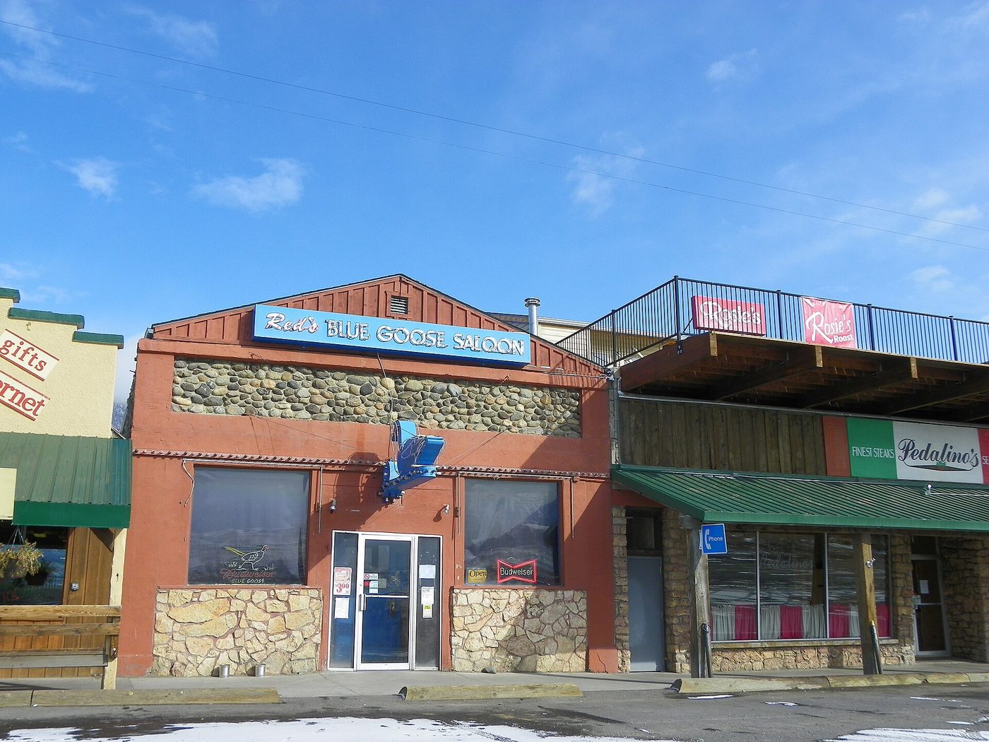A stone-fronted storefront on the main street in Gardiner, Montana