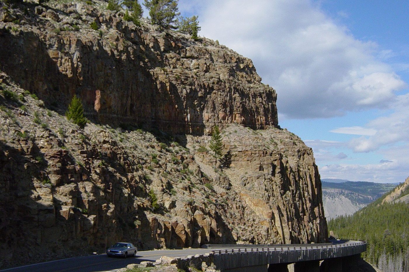 The Grand Loop Road built along a sheer cliff of welded tuff at Golden Gate