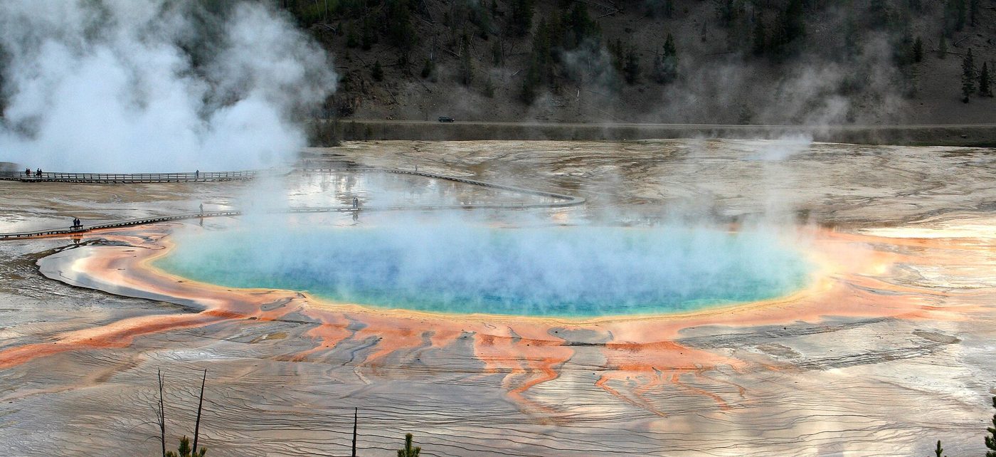 Steam rising thickly off the blue centre and orange edges of Grand Prismatic Spring