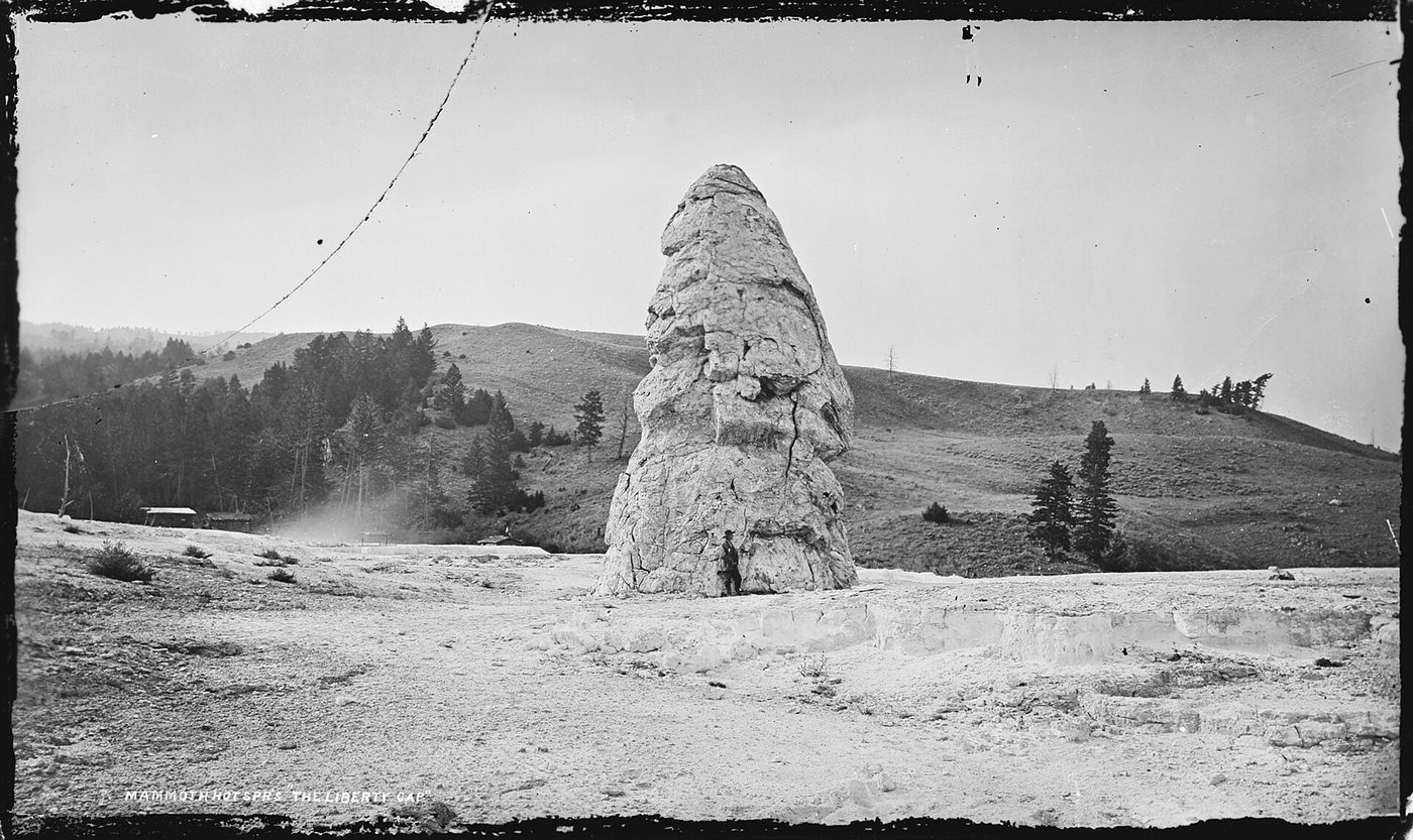 Black-and-white 19th-century photograph of the Liberty Cap travertine cone