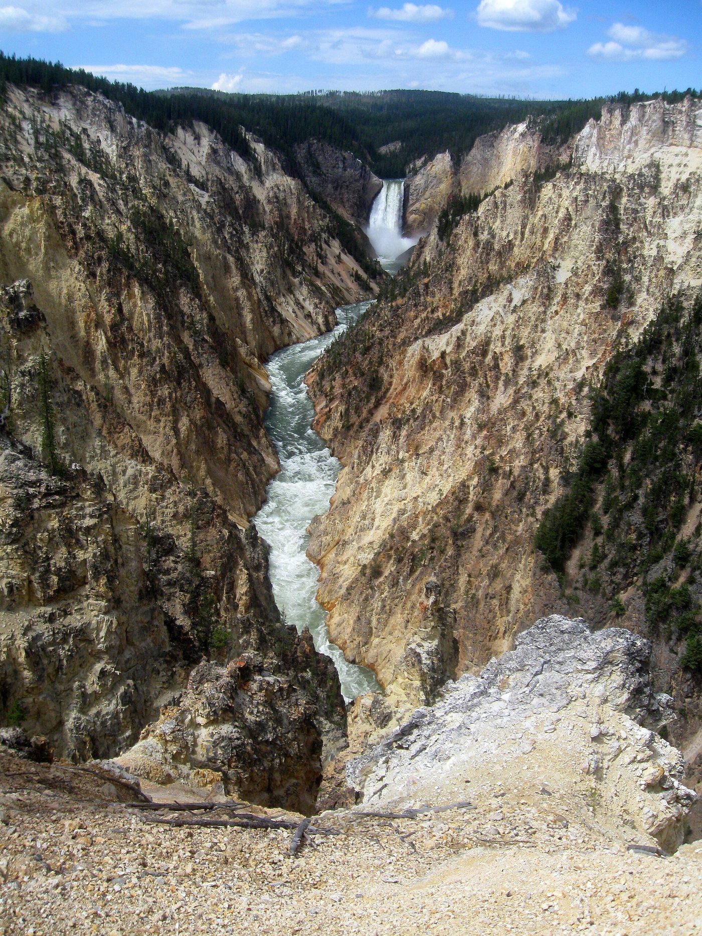 The Lower Falls of the Yellowstone River seen from Artist Point, framed by yellow canyon walls