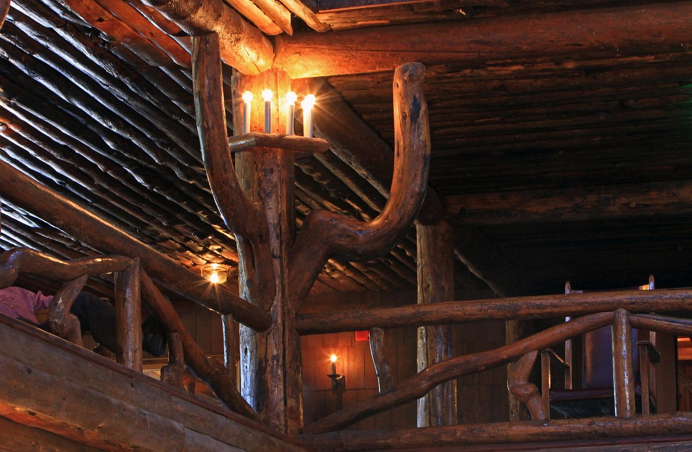 Gnarled lodgepole pine balconies and candle-style light fixtures in the six-storey lobby