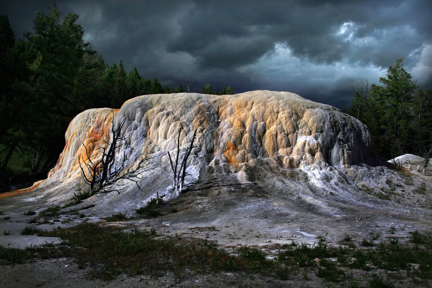 Orange Spring Mound, a rounded travertine mound streaked with orange and white