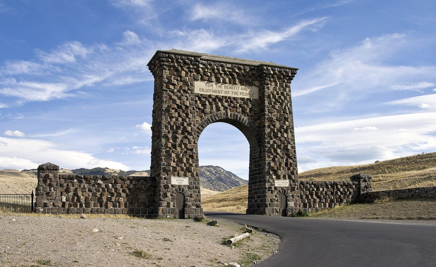 The stone Roosevelt Arch at Yellowstone's North Entrance, inscribed For the benefit and enjoyment of the people