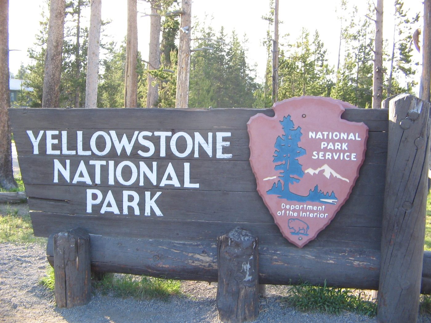 The wooden Yellowstone National Park sign with the NPS arrowhead at the South Entrance