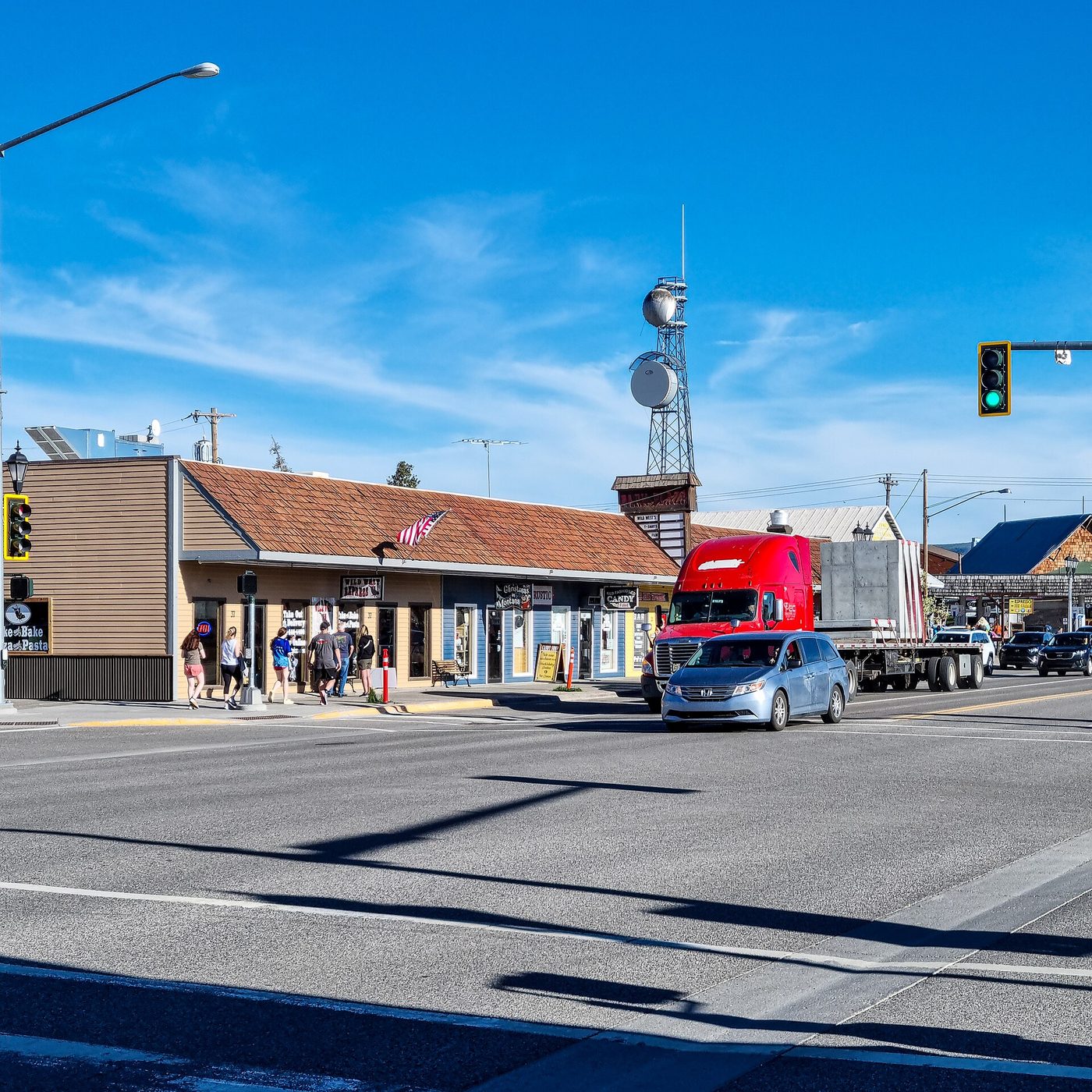 Shops and a red truck on Canyon Street in the Montana gateway town