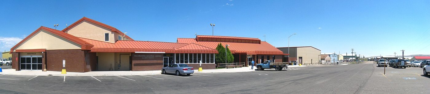 Low terminal building with red roofs at Yellowstone Regional Airport in Cody, Wyoming